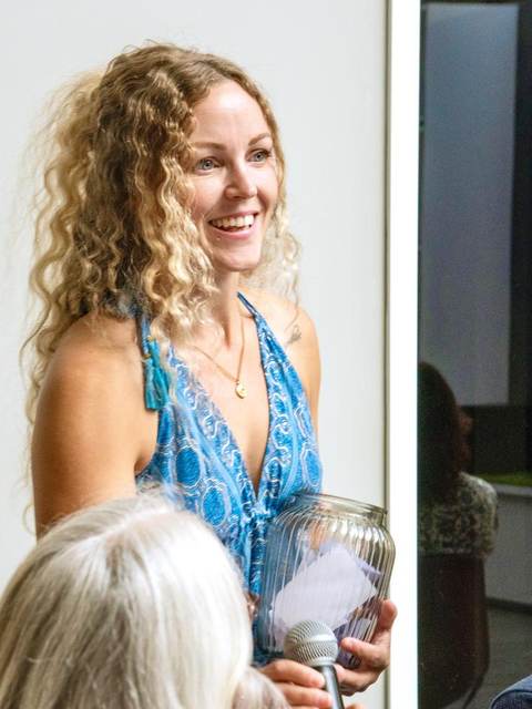 Cass Henry smiling while coaching a group