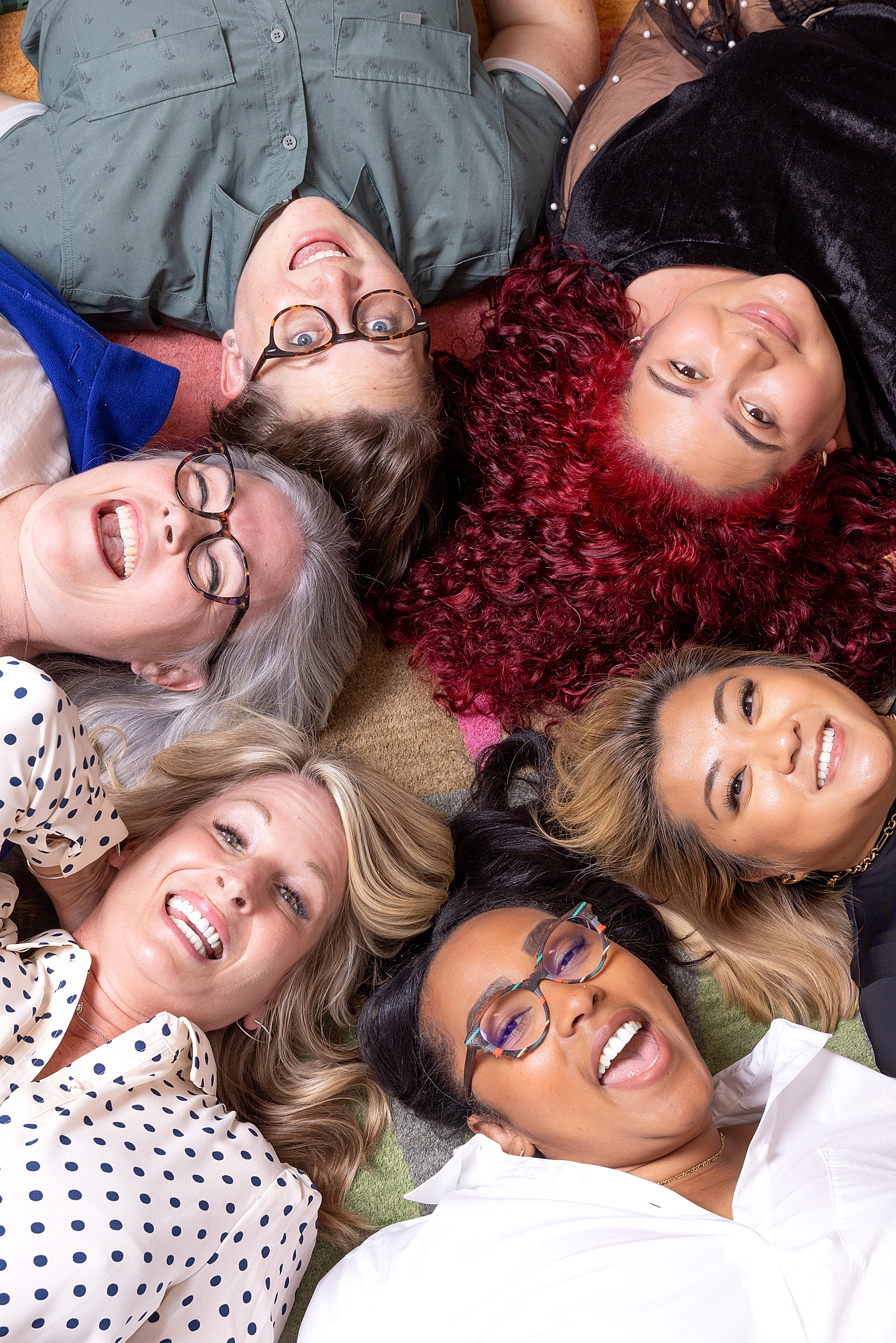 Wishful Doing Team The faces of six members of the Wishful Doing team arranged in a circle.