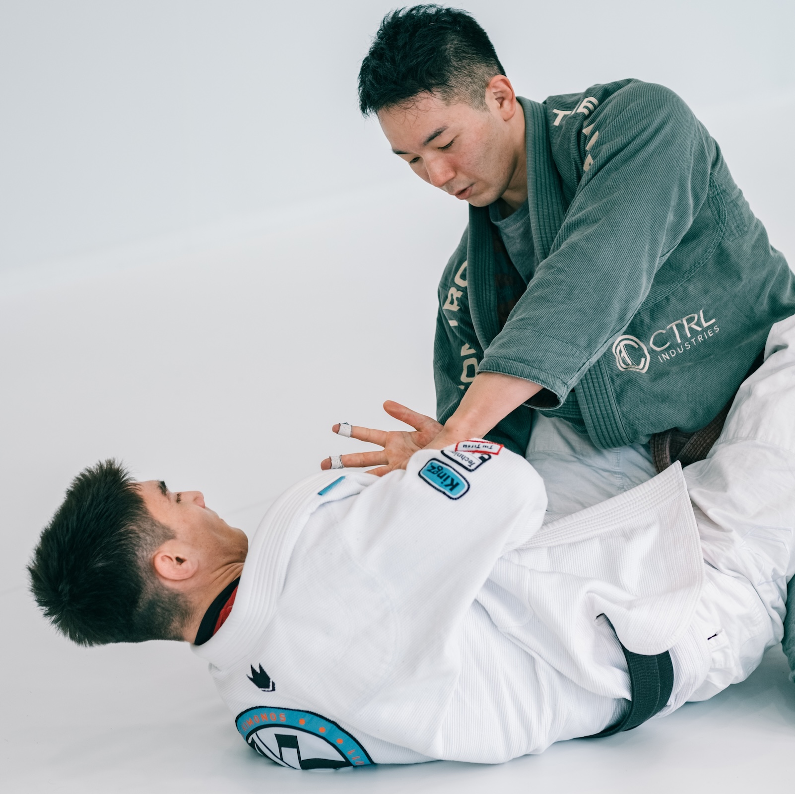 Training closed guard against live resistance