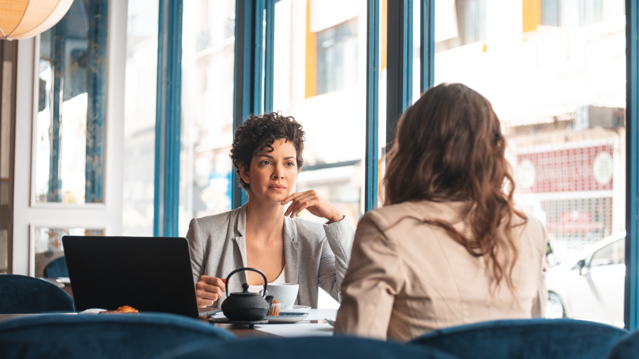 Professional coaching conversation focused on presence, reflection, and active listening
