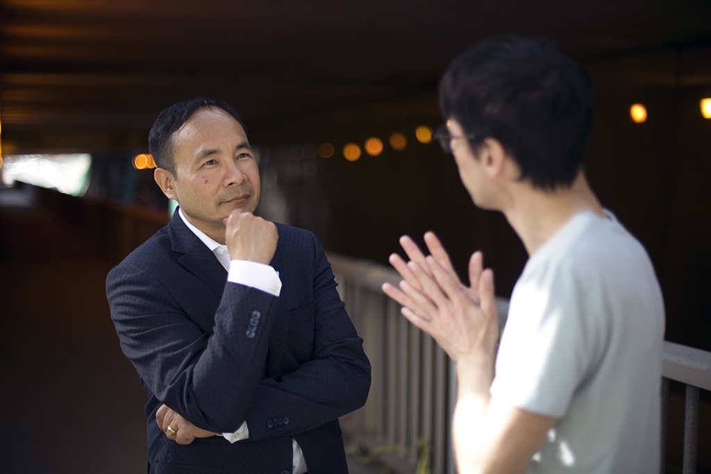 Tito Kang listening during a one-on-one coaching conversation