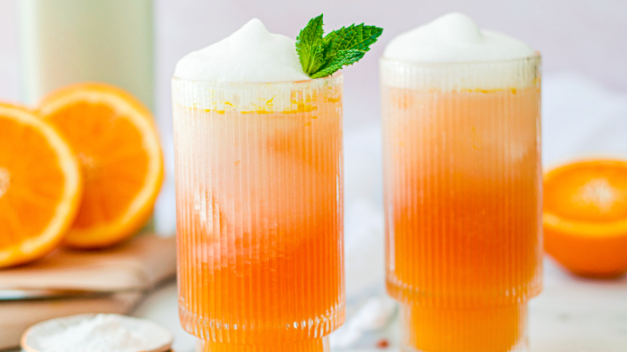 Adrenal mocktail made with orange juice, sea salt, cream of tartar, collagen, and coconut cream — a nervous system support drink for stress, adrenal fatigue, and energy stabilization.