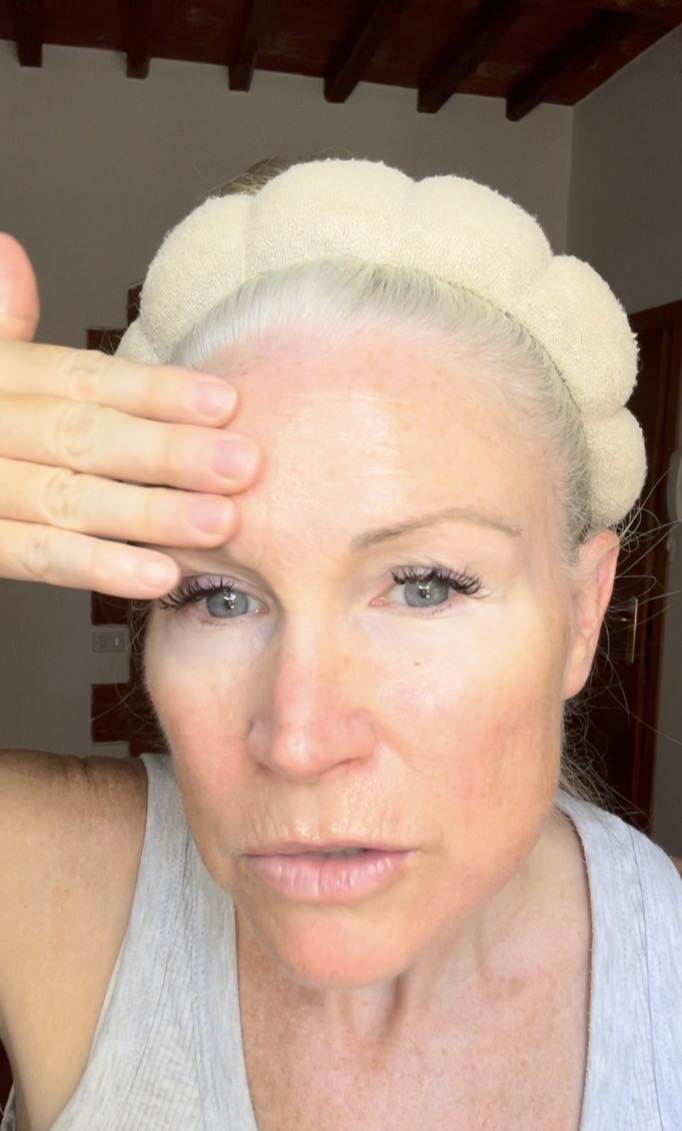 Liz doing a face yoga exercise