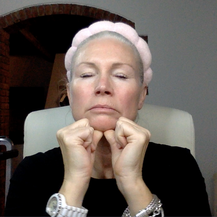 Liz doing a face yoga exercise