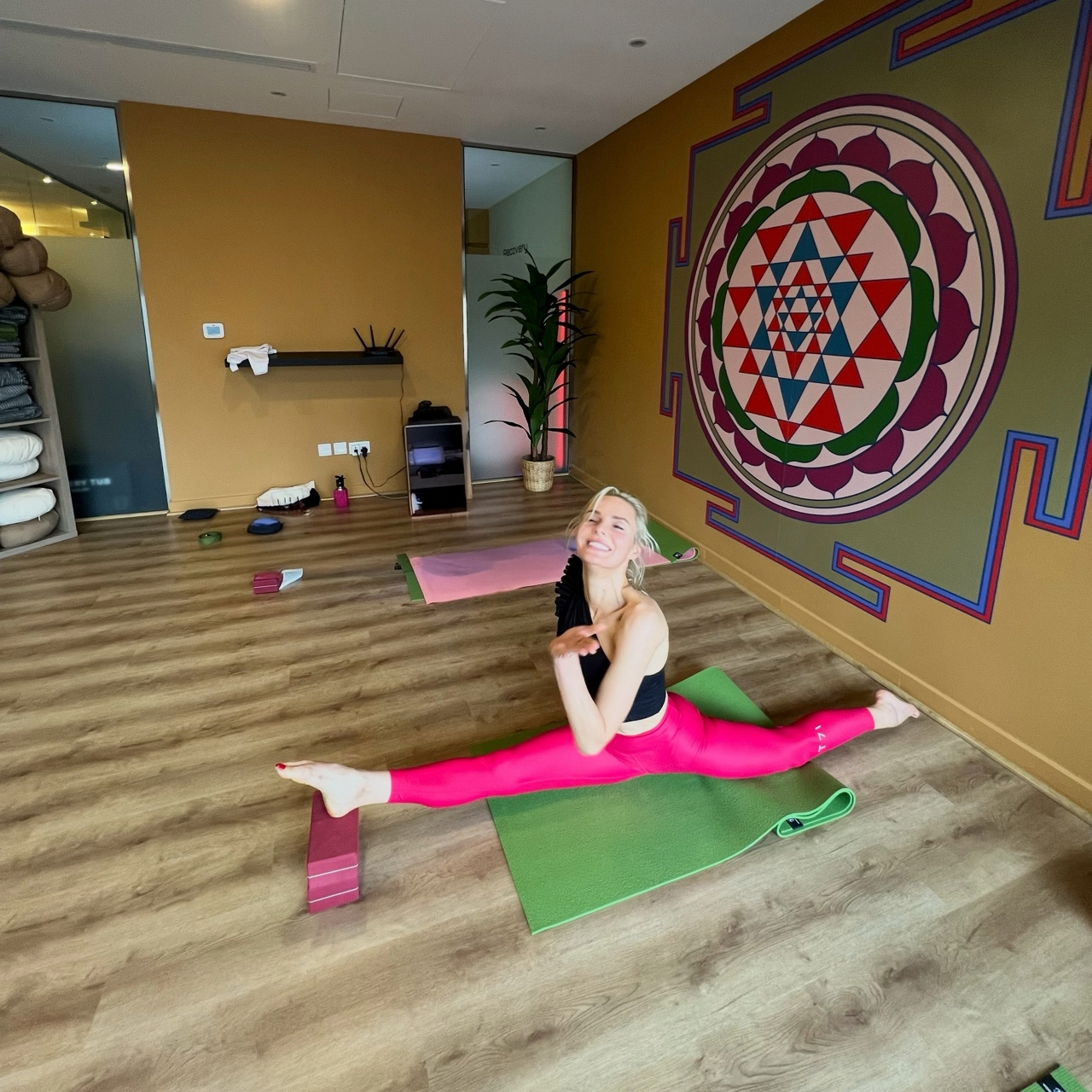 Karolina H. practicing her split in yoga