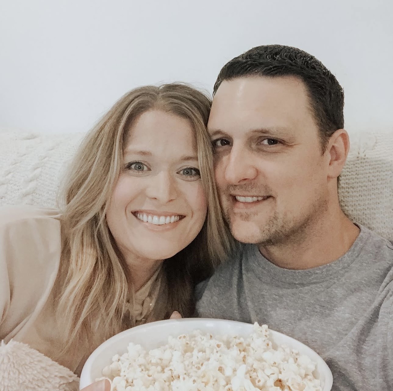 Jess and Trae with a bowl of popcorn