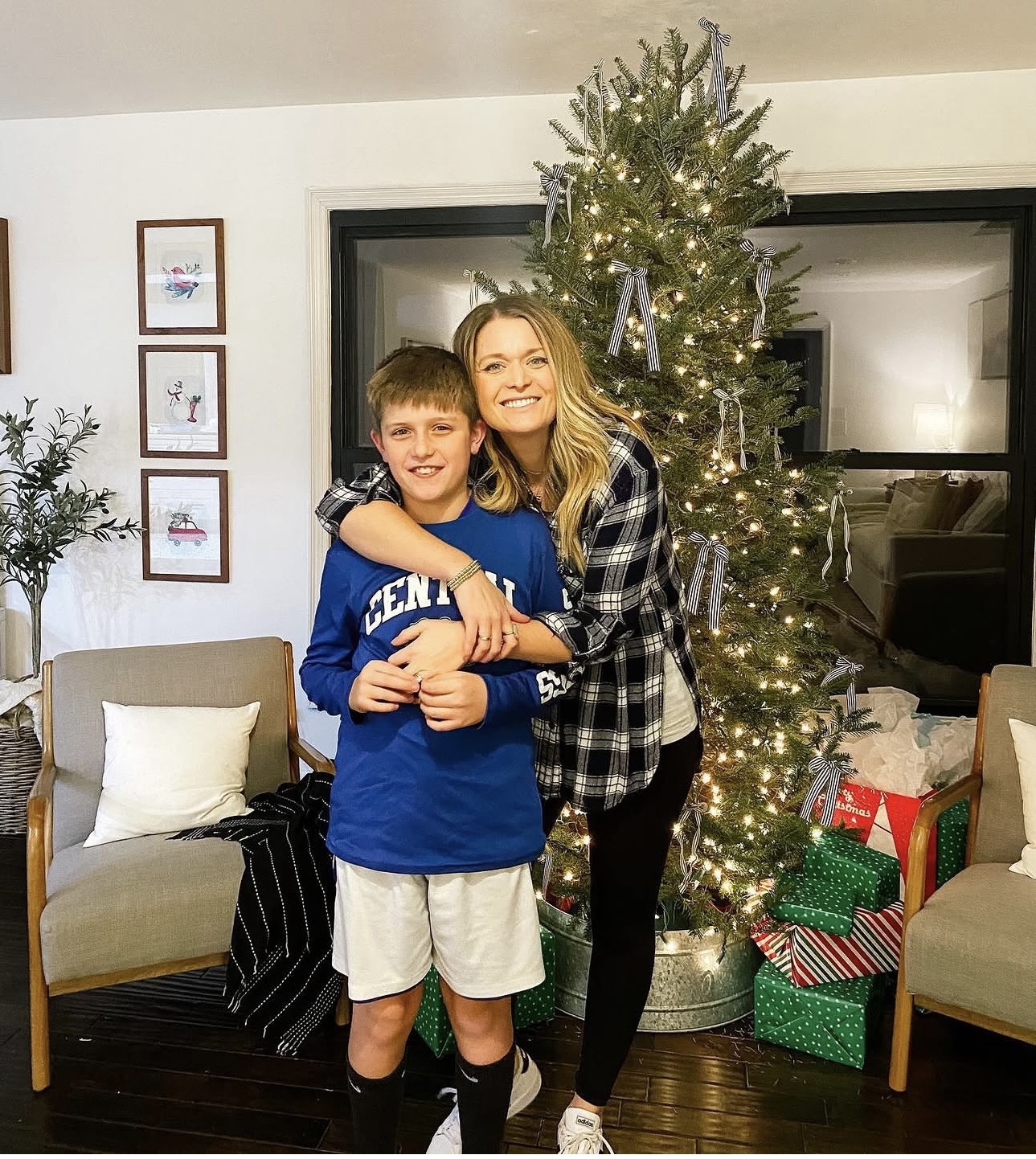 Jess and her son by the Christmas tree