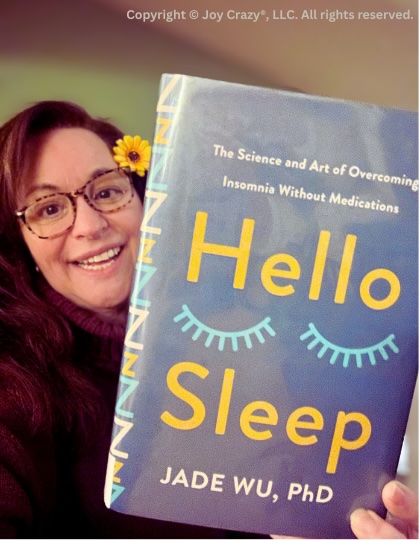 Joy Crazy founder Shannon Paul holds the book,&nbsp;Hello Sleep&nbsp;by Dr. Jade Wu