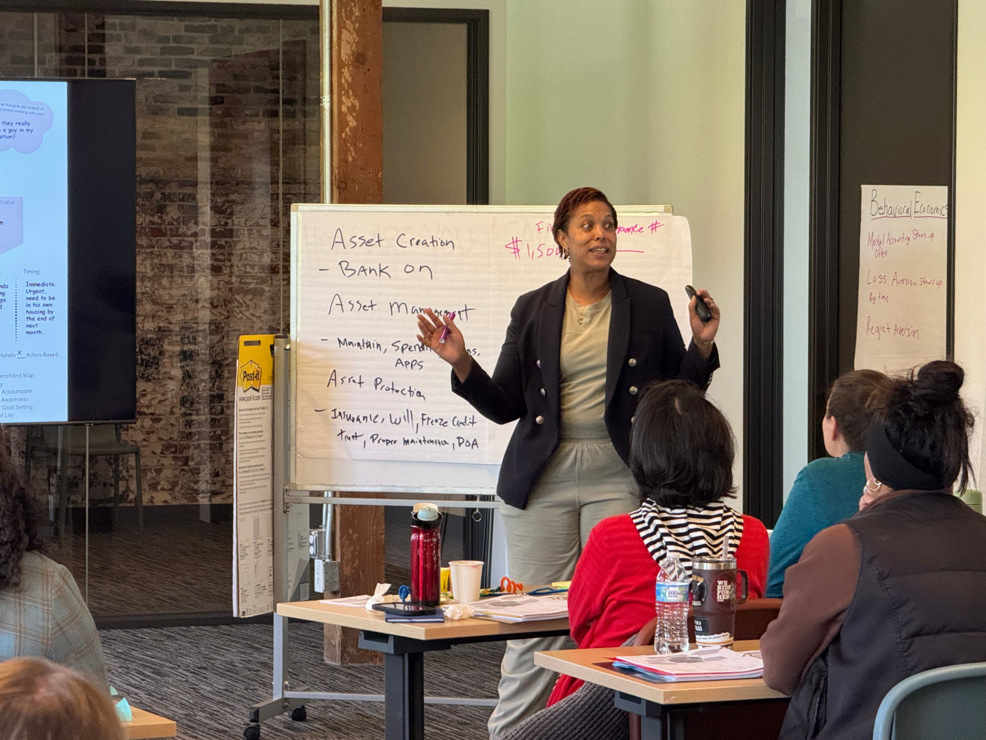 A certified co-facilitator leading a Financial Coaching for Prosperity training session