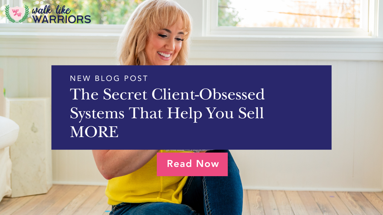 Female entrepreneur creating client onboarding and customer experience systems on a laptop