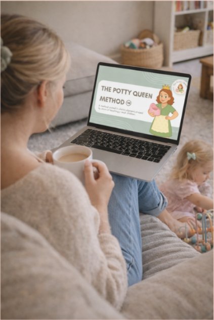 A mum watching The Potty Queen Method course on her laptop at home, with her toddler beside her