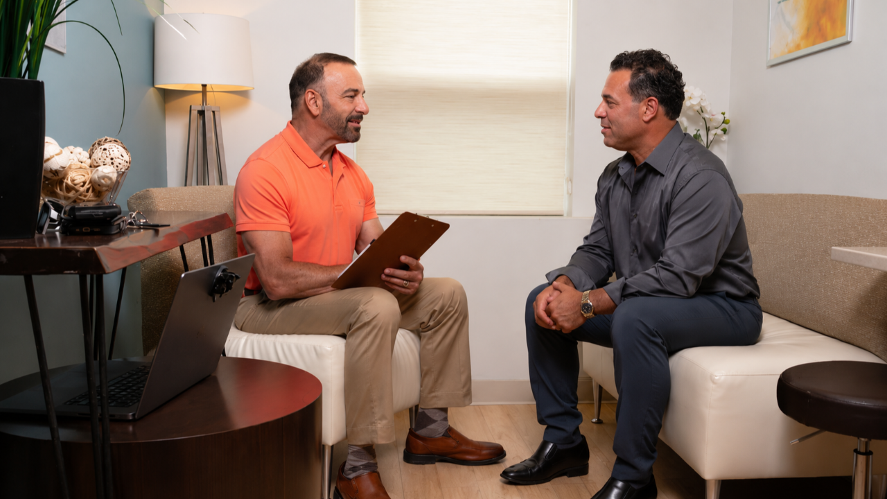 Dr. Petteruti with a male patient during a consultation for hormone replacement therapy