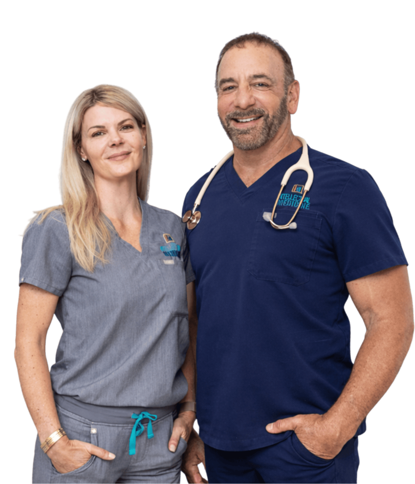 Dr. Petteruti and Shannon Petteruti standing in scrubs