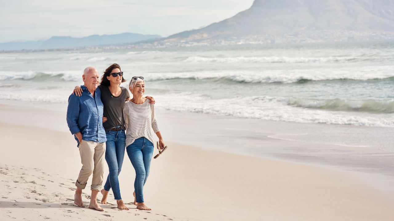 Happy Man walking on the beach avoiding regret with Prostate Cancer 