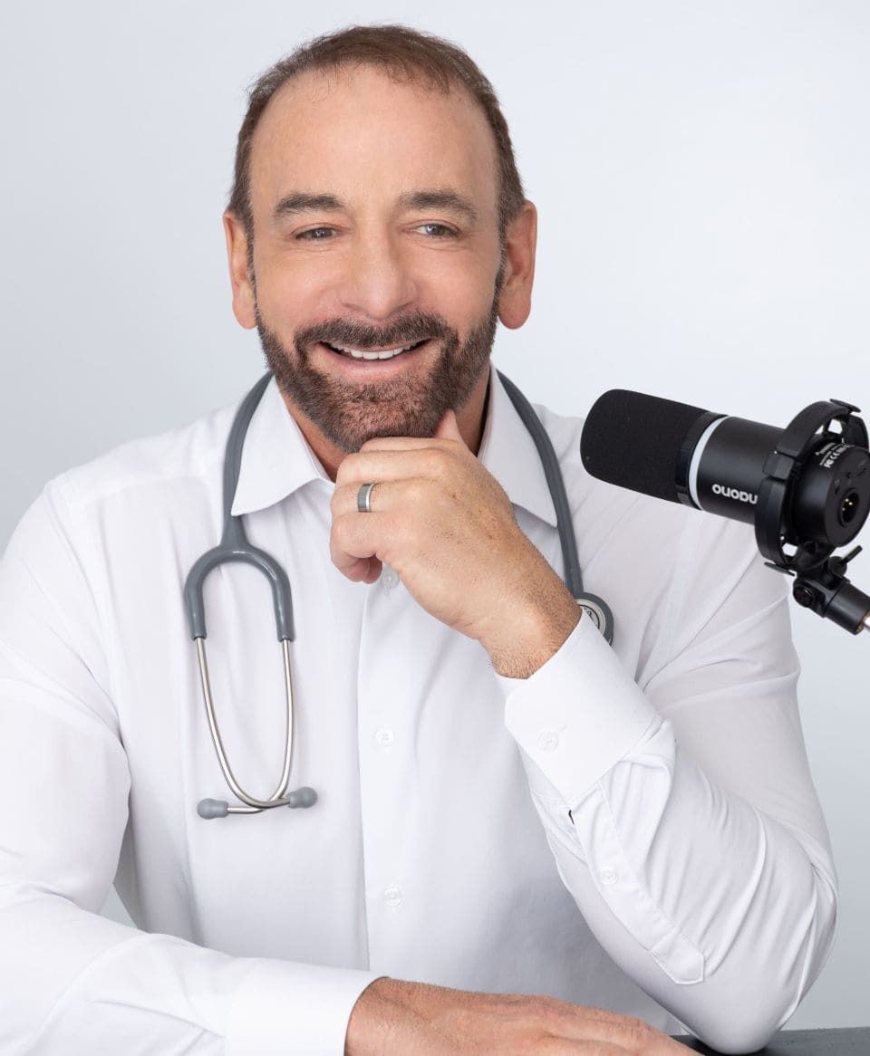 Dr. Petteruti sitting at his podcast desk