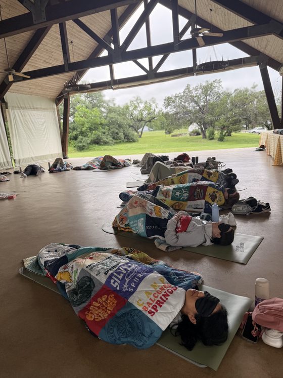 Group breathwork session in an Austin pavilion