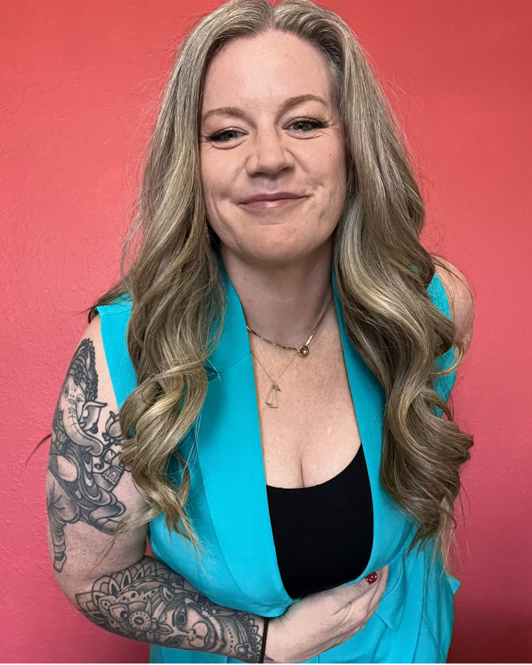 Heather Petrosky, founder of We Be Yoga, in a teal blazer