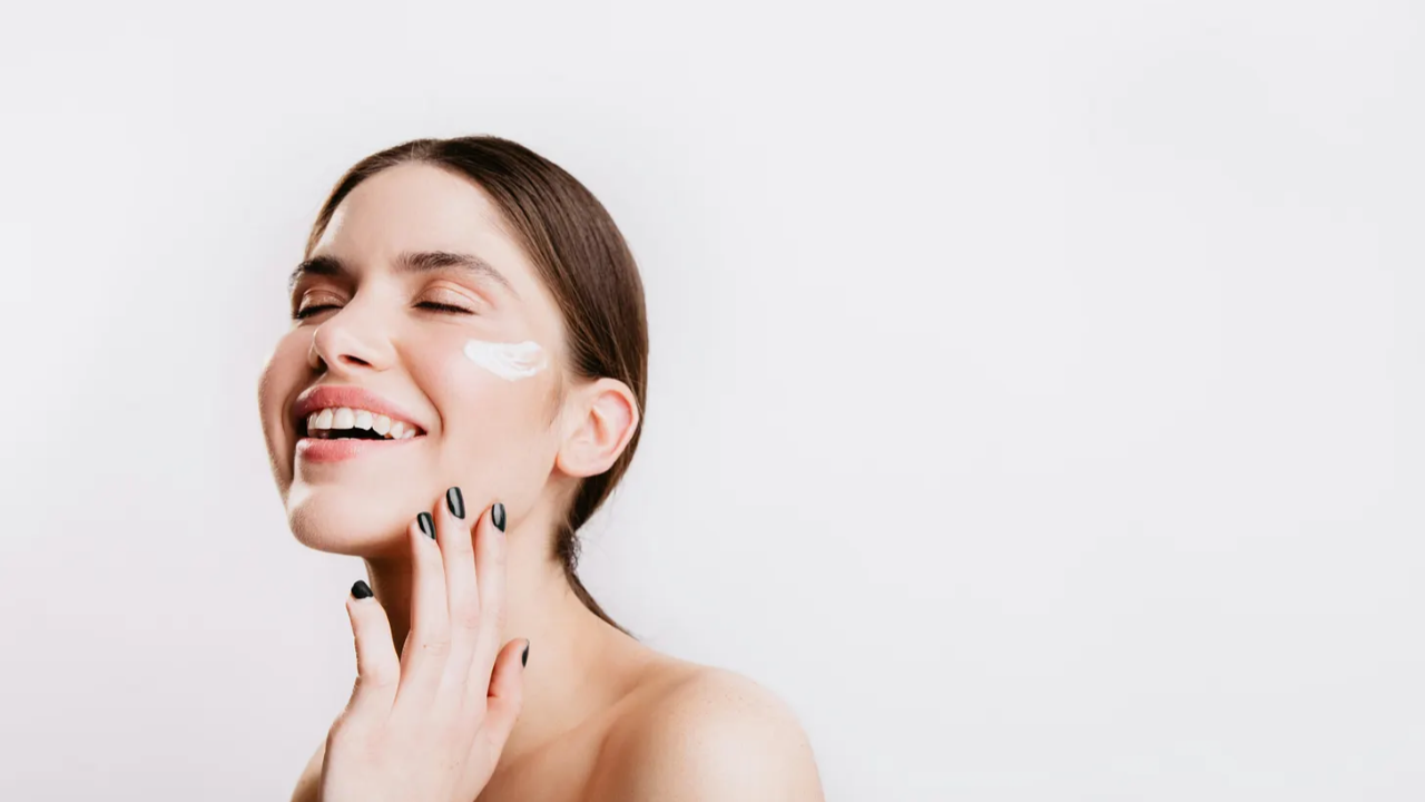 woman cream on face
