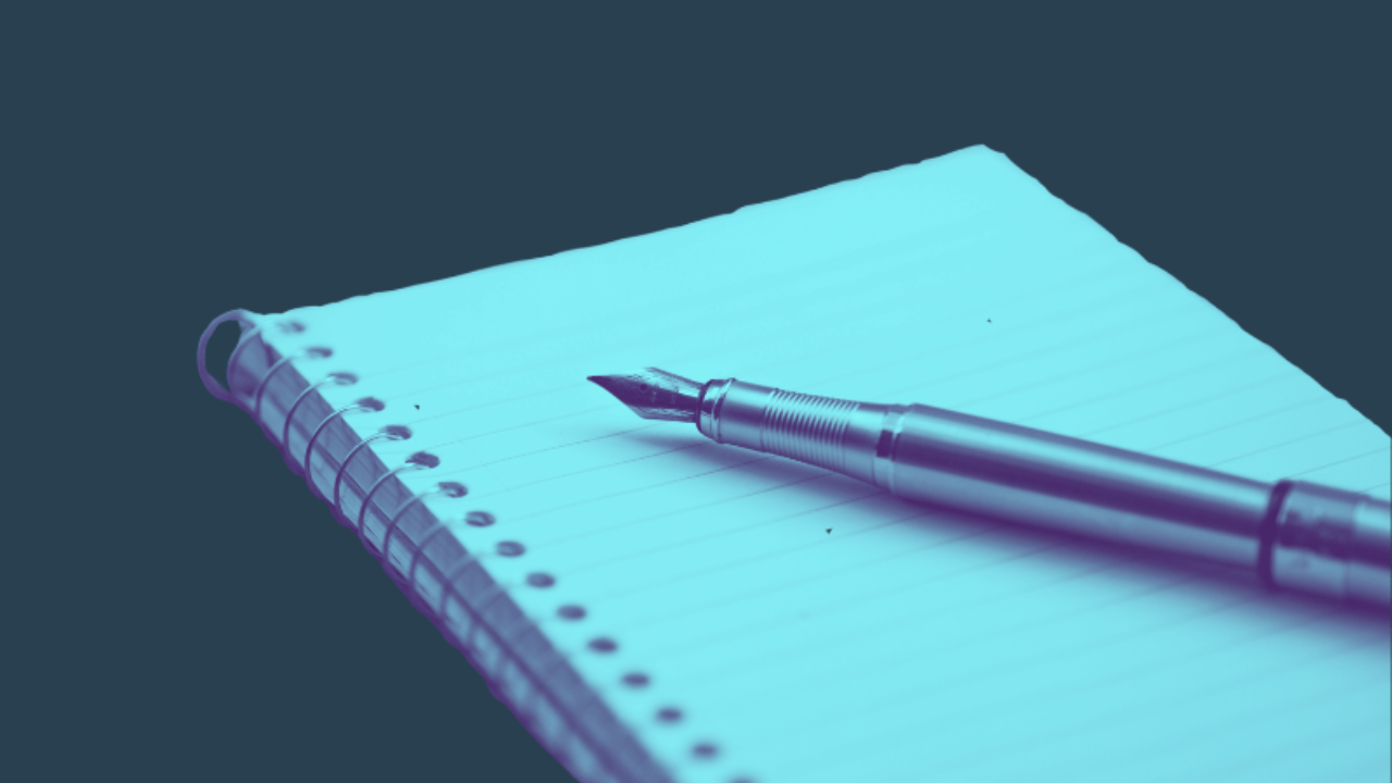 pen ad paper representing the strategy behind finding the ideal customer