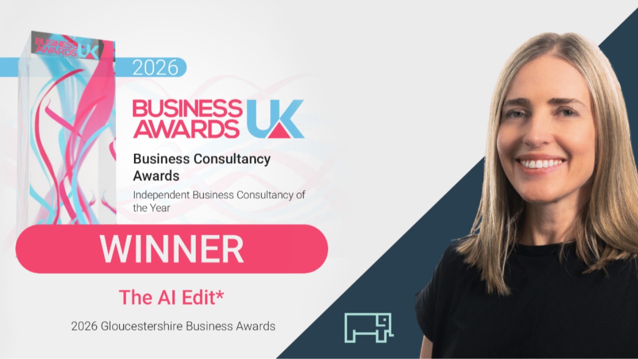 Heather next to the awards badge given by Business Awards UK.