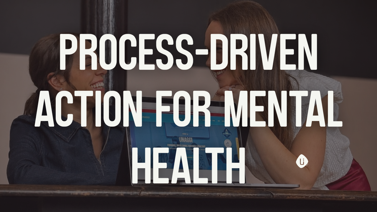 Co-Founders of Emotional Intelligence smiling at work discussing mental health