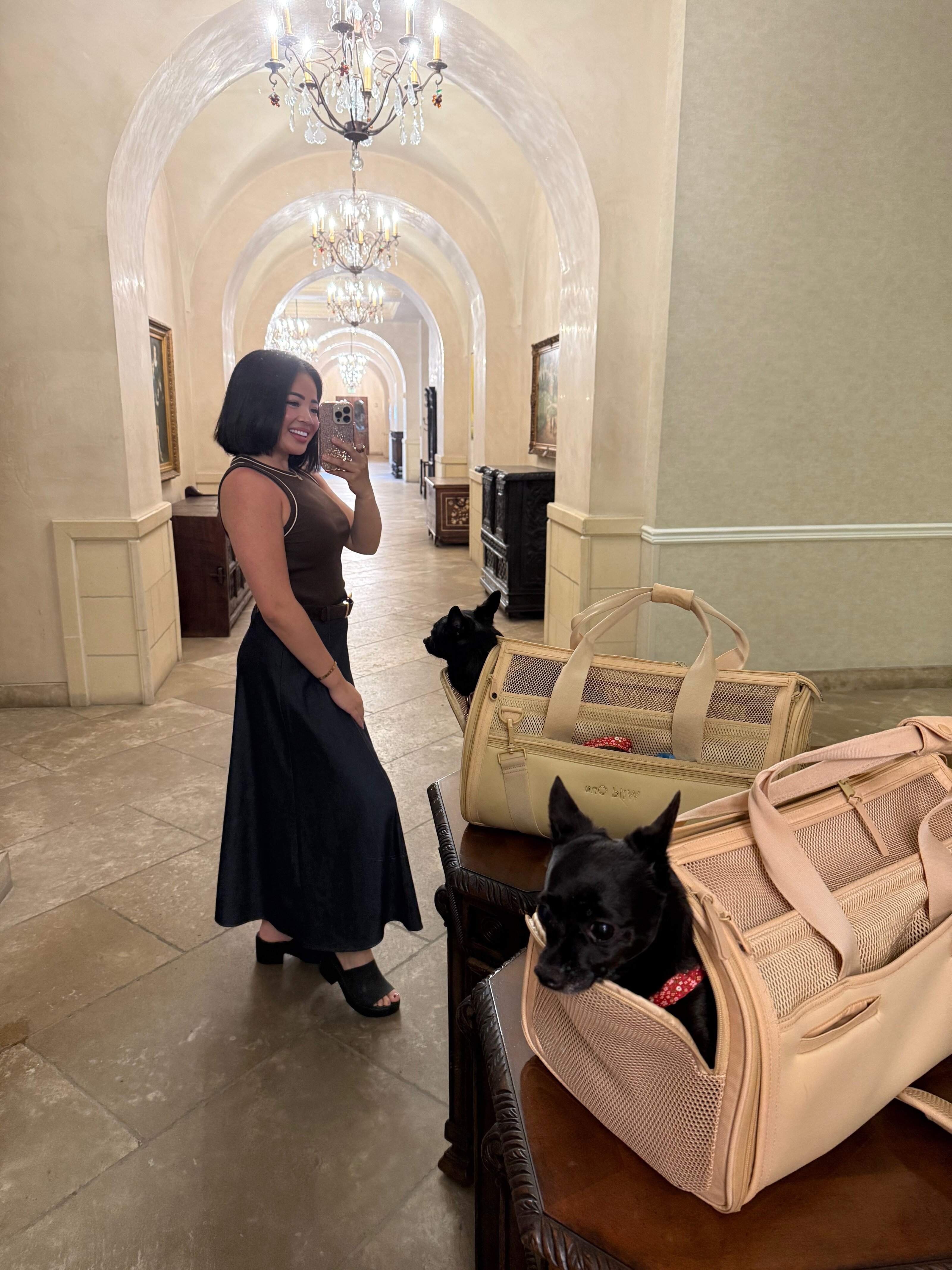 Megan in an arched hallway with her dog