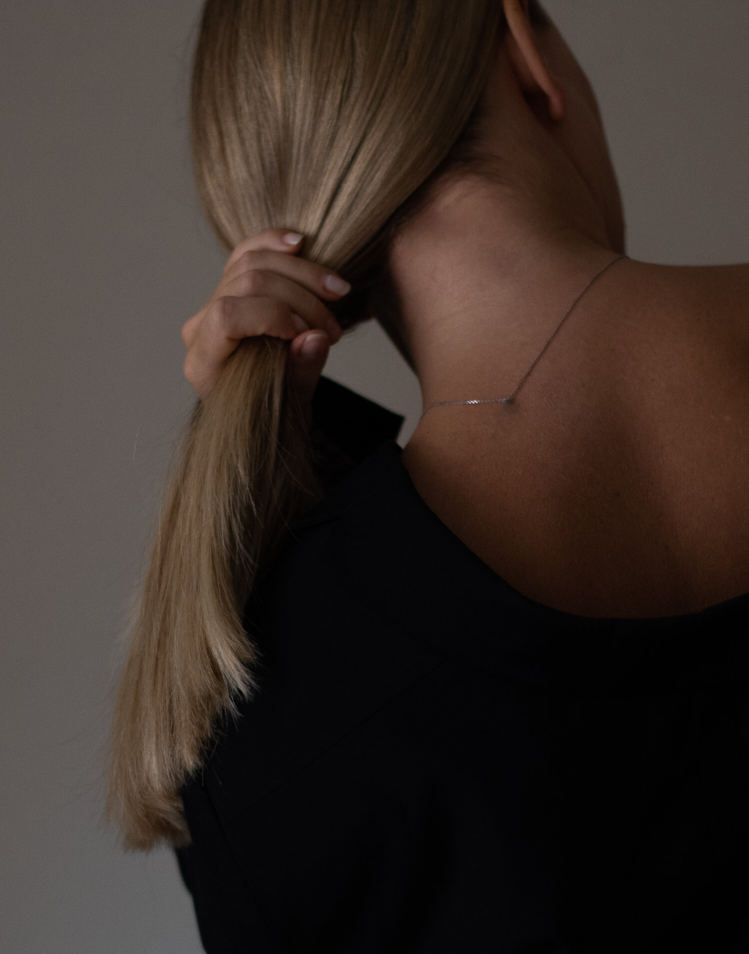 Woman tying her hair