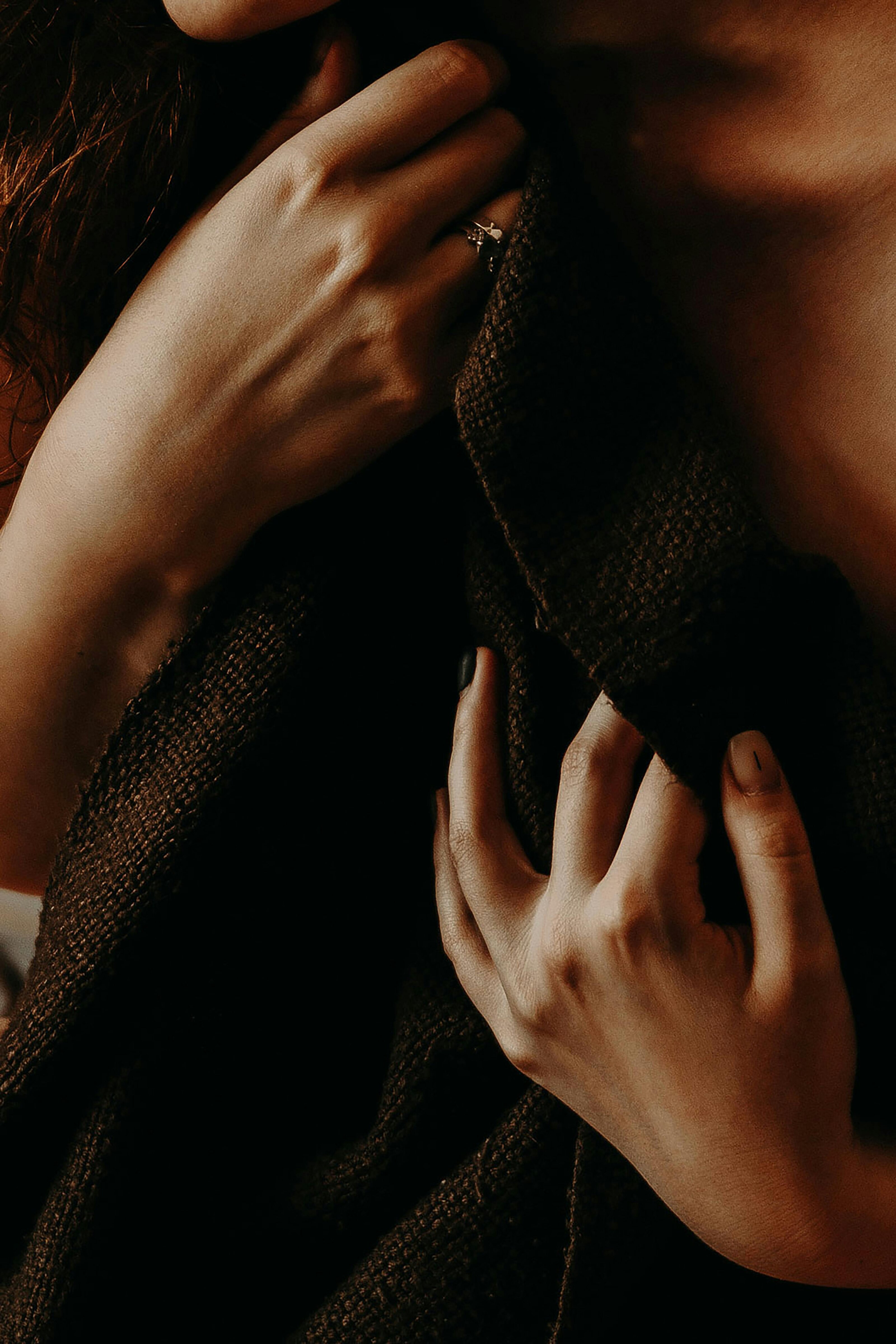 Hand resting on dark knit
