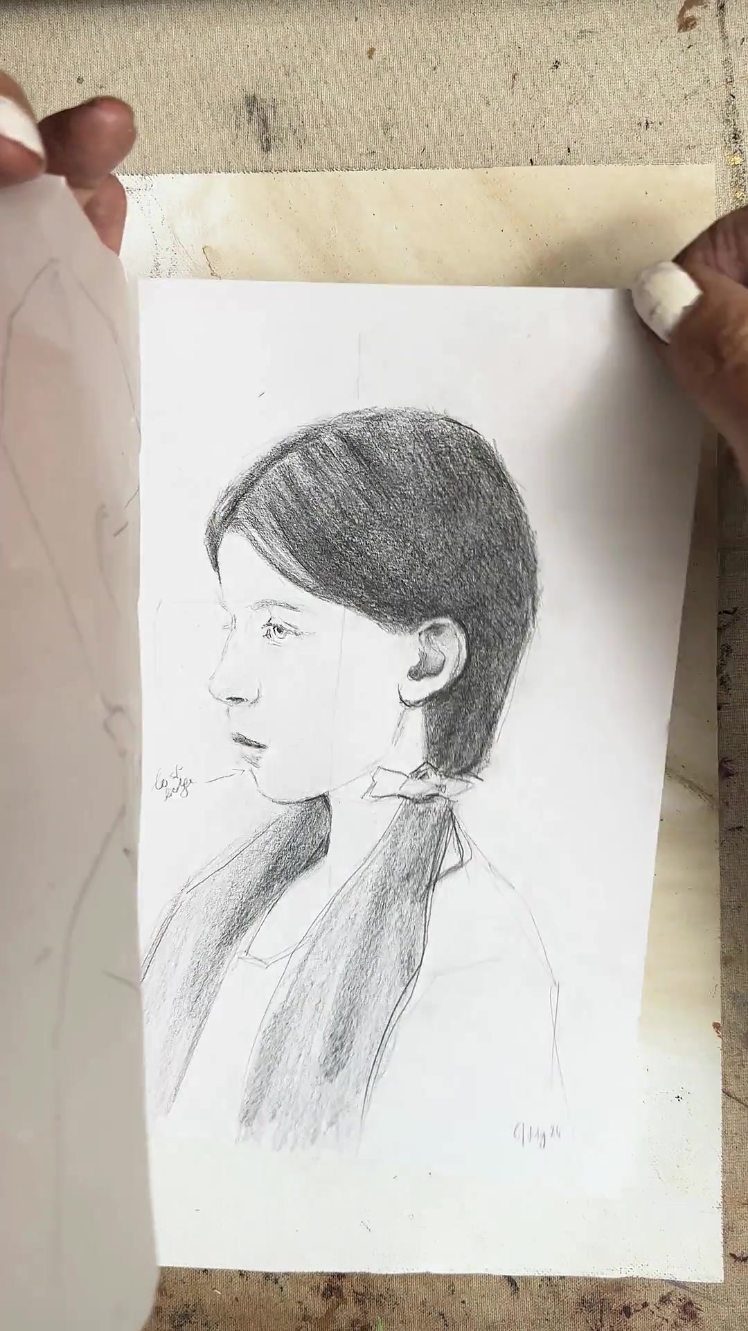 Placing the drawing under the tracing paper