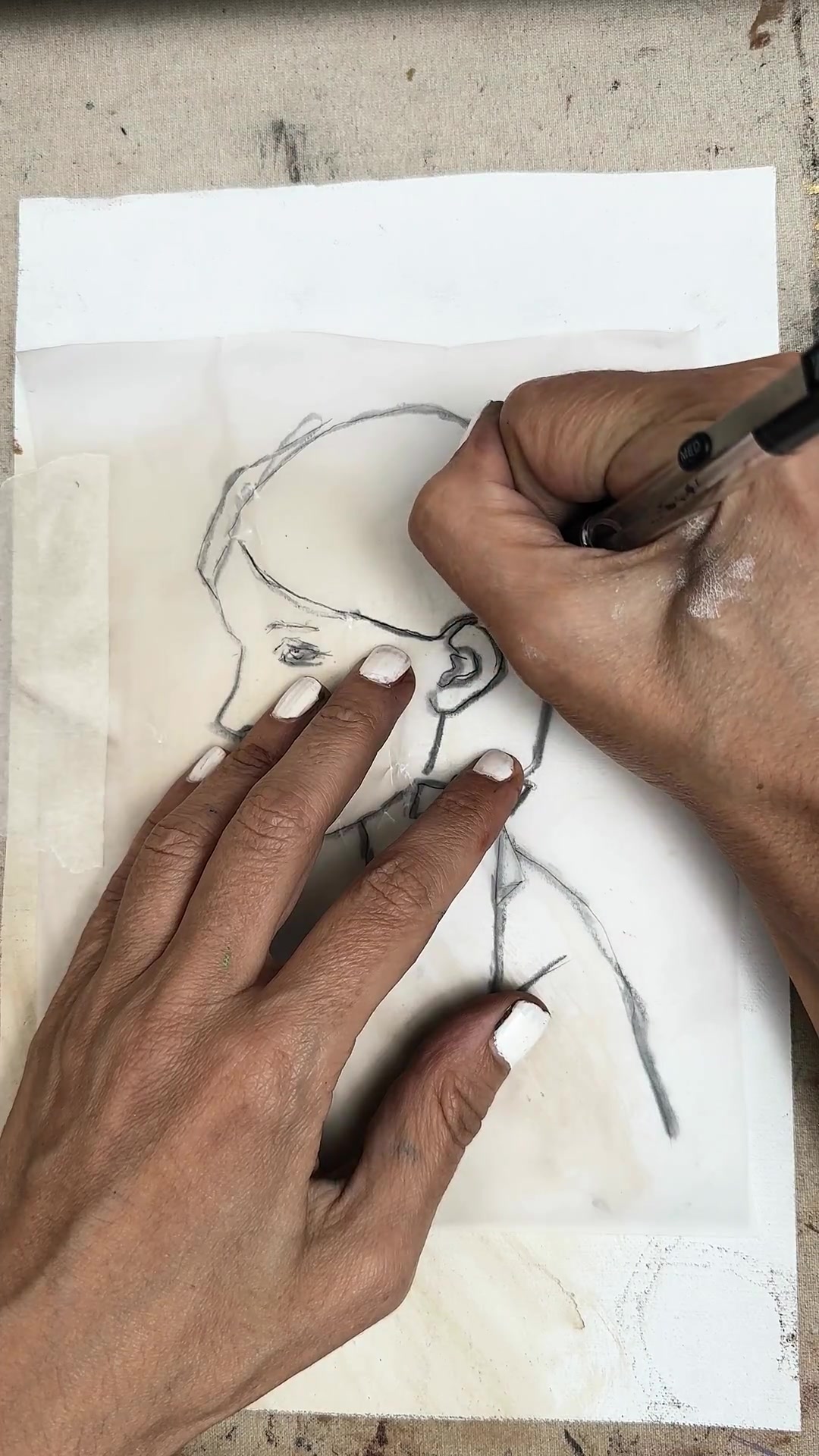 Pressing over the lines to transfer the charcoal