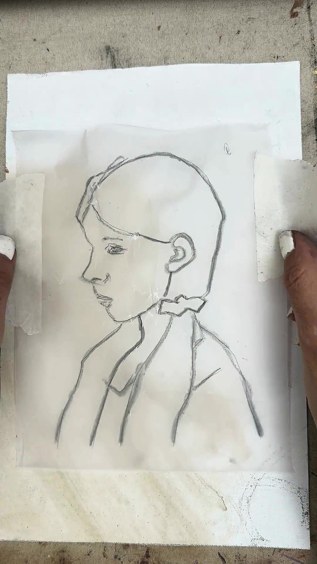 Tracing paper taped onto the canvas