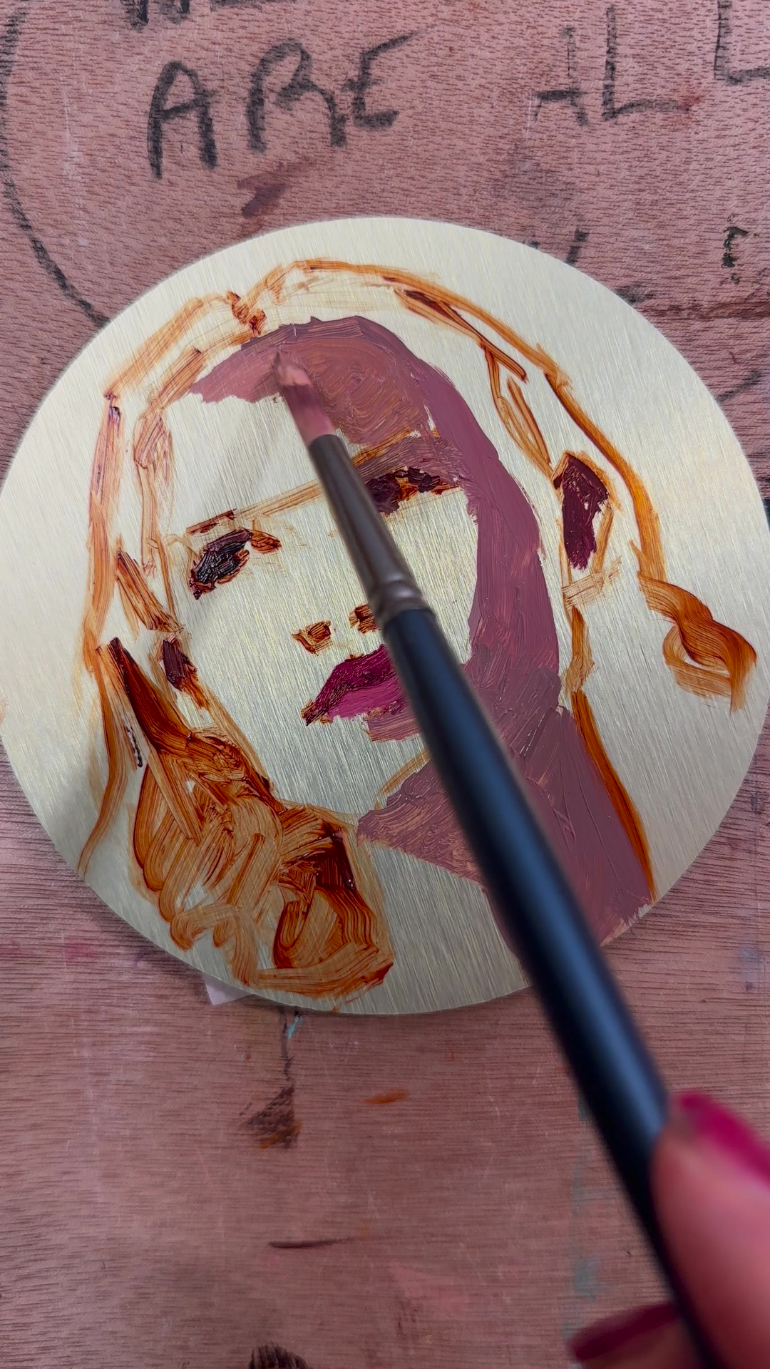 Thin shadow shapes blocked in on the aluminium portrait with a brush