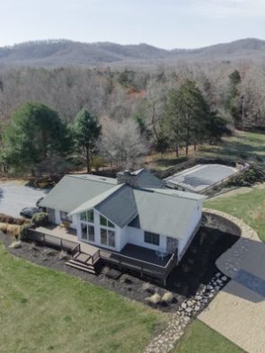 Aerial view of the farmhouse, pool and mountain grounds at Solara Ridge