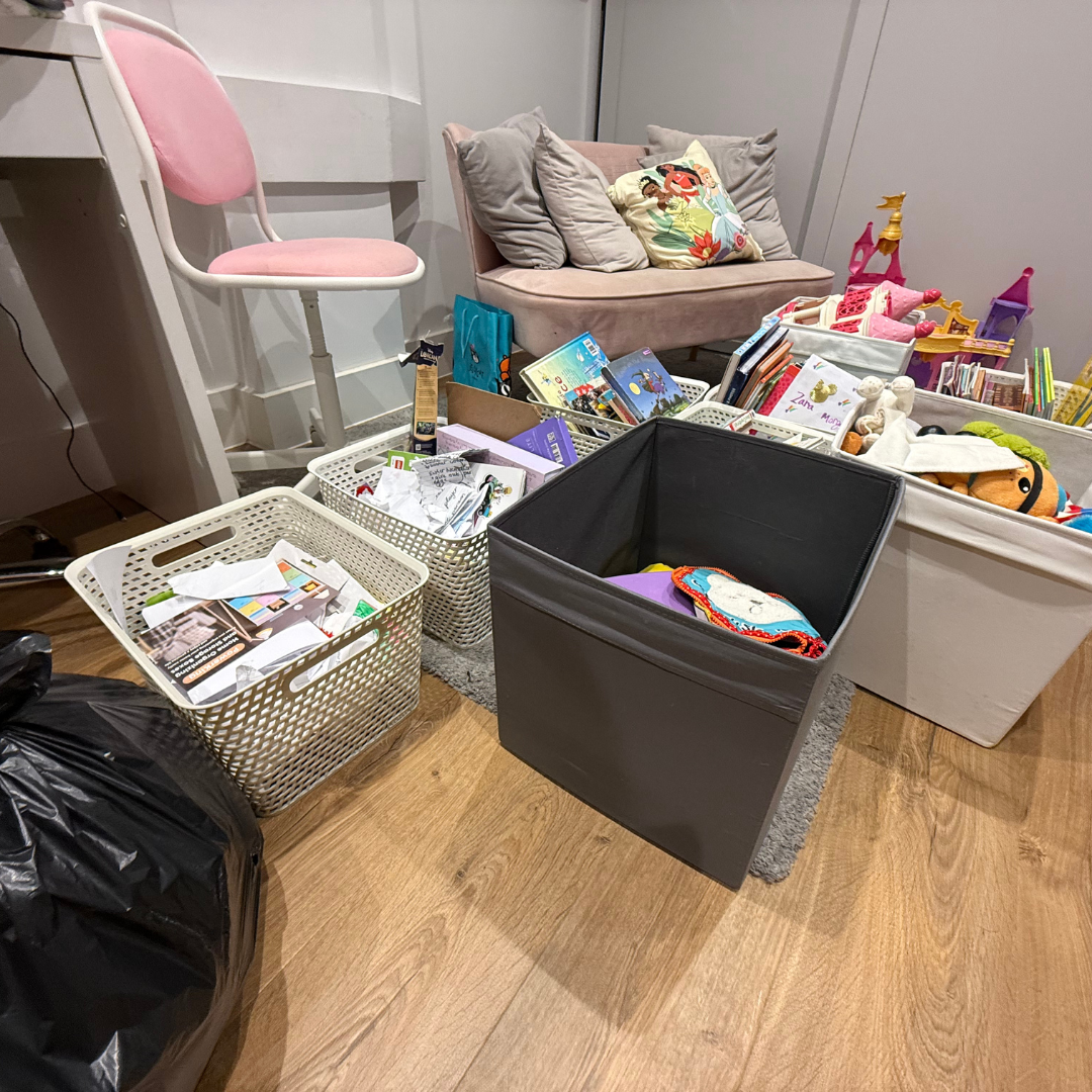 Boxes piled up in a messy playroom