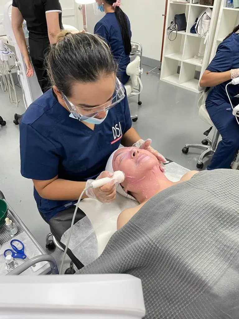 Hands-on facial specialist training at DermaSwiss Institute, Miami