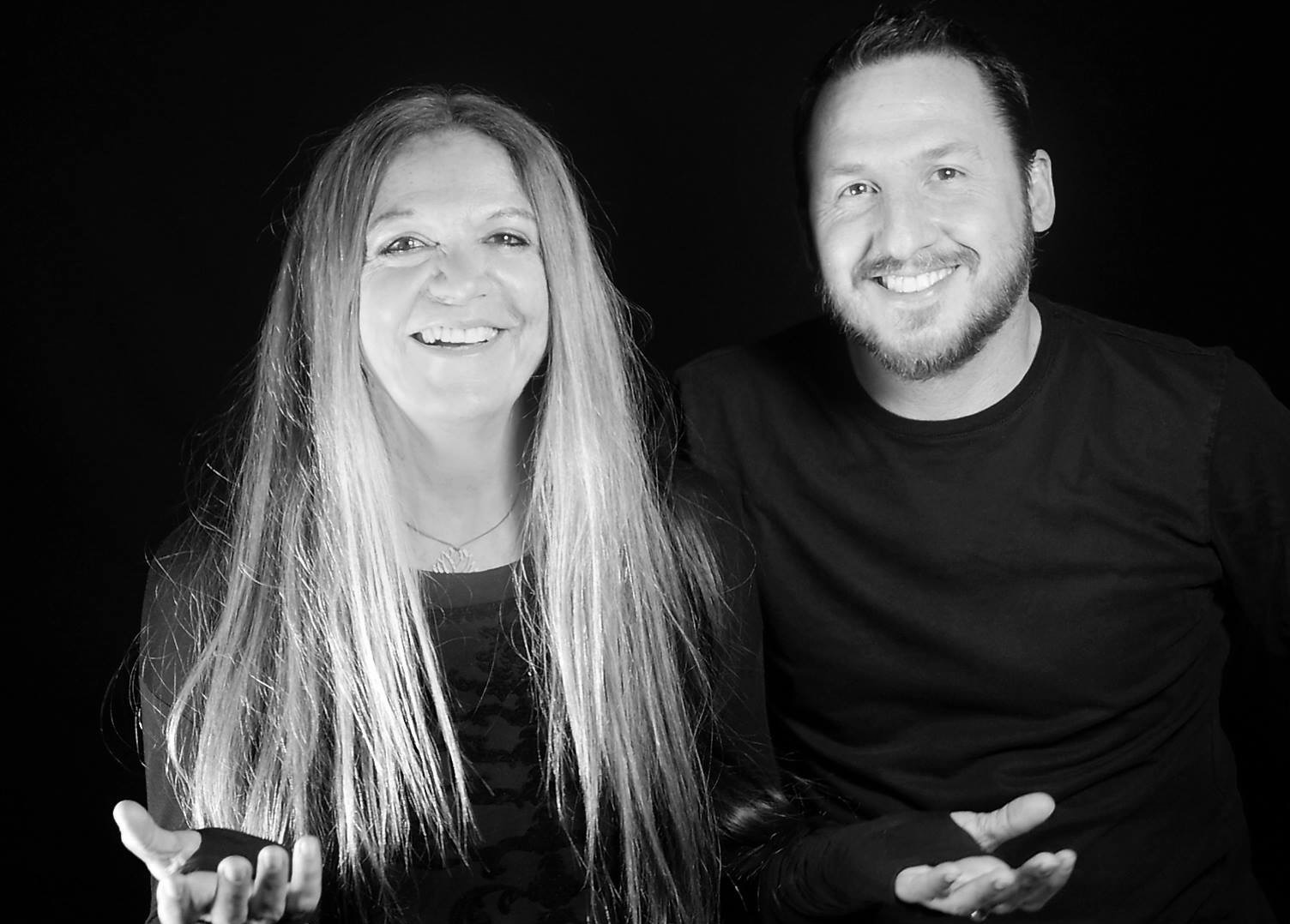 Silvia Nakkach and Todd Boston, hands open, photographed in black and white