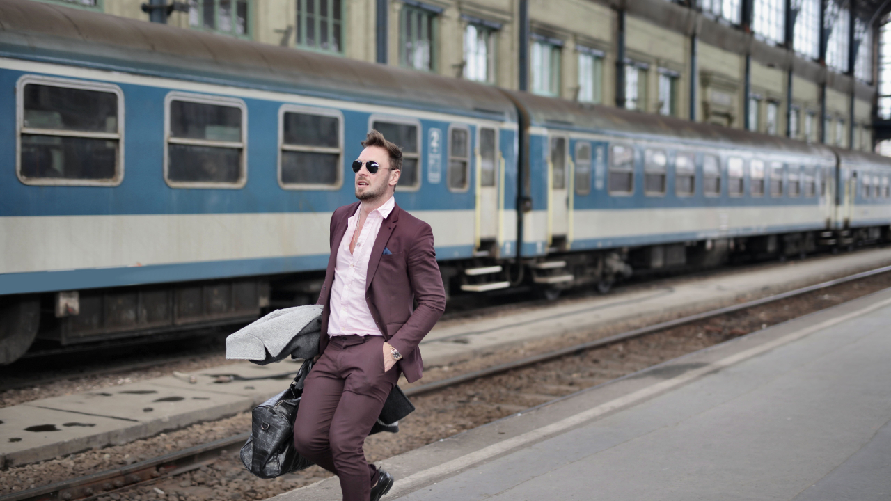 A single man traveling with his suitcase.