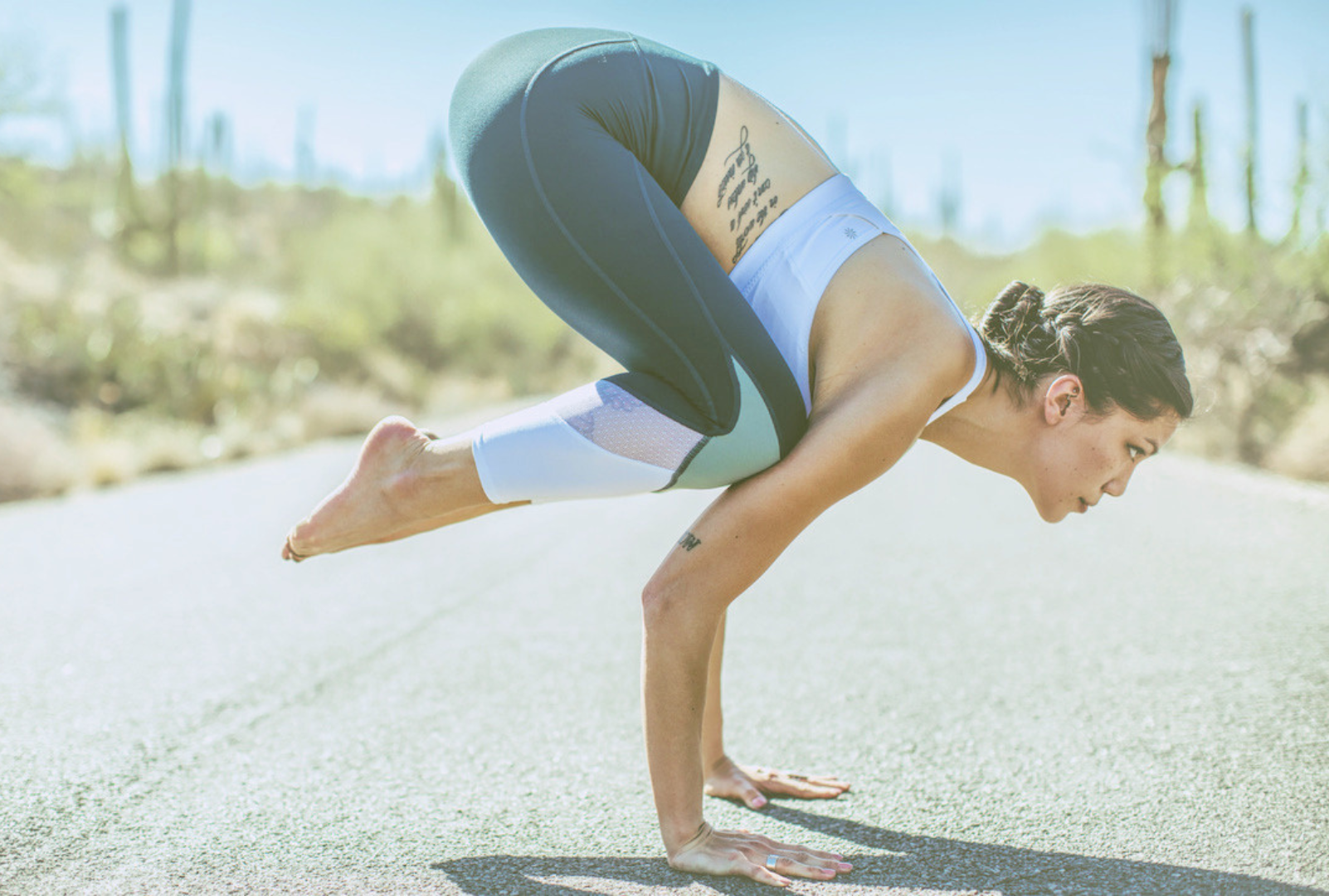Yoga practitioner demonstrating crow pose to build upper body strength, balance, and mindful movement control