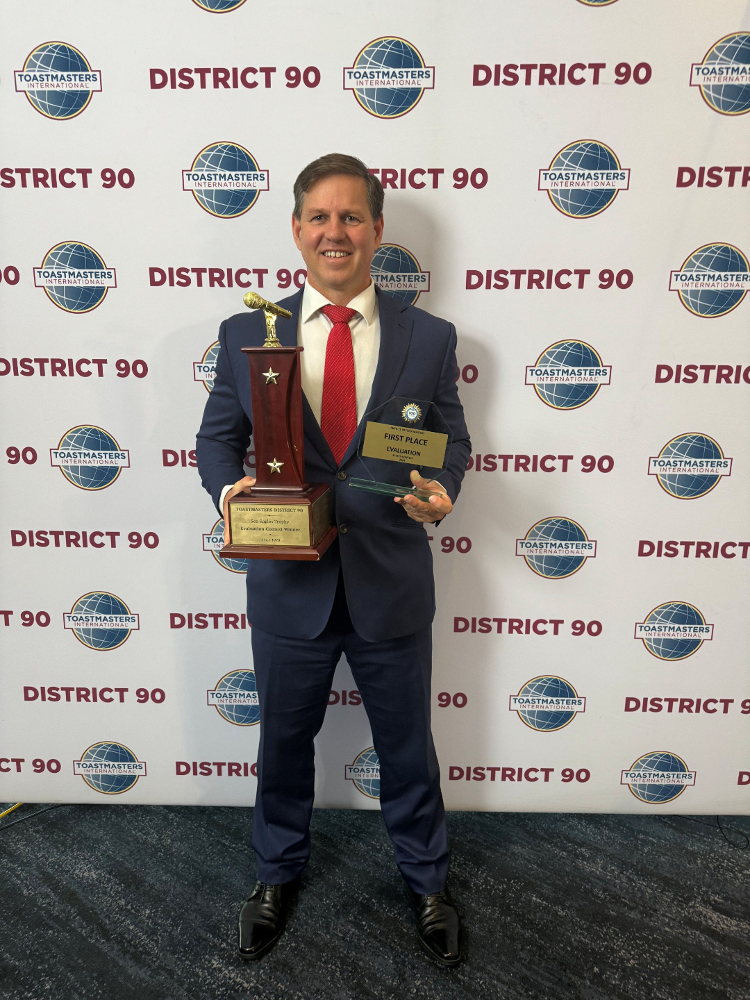 Professional Speaker Gerard Barwell holding Toastmasters Speaking Awards
