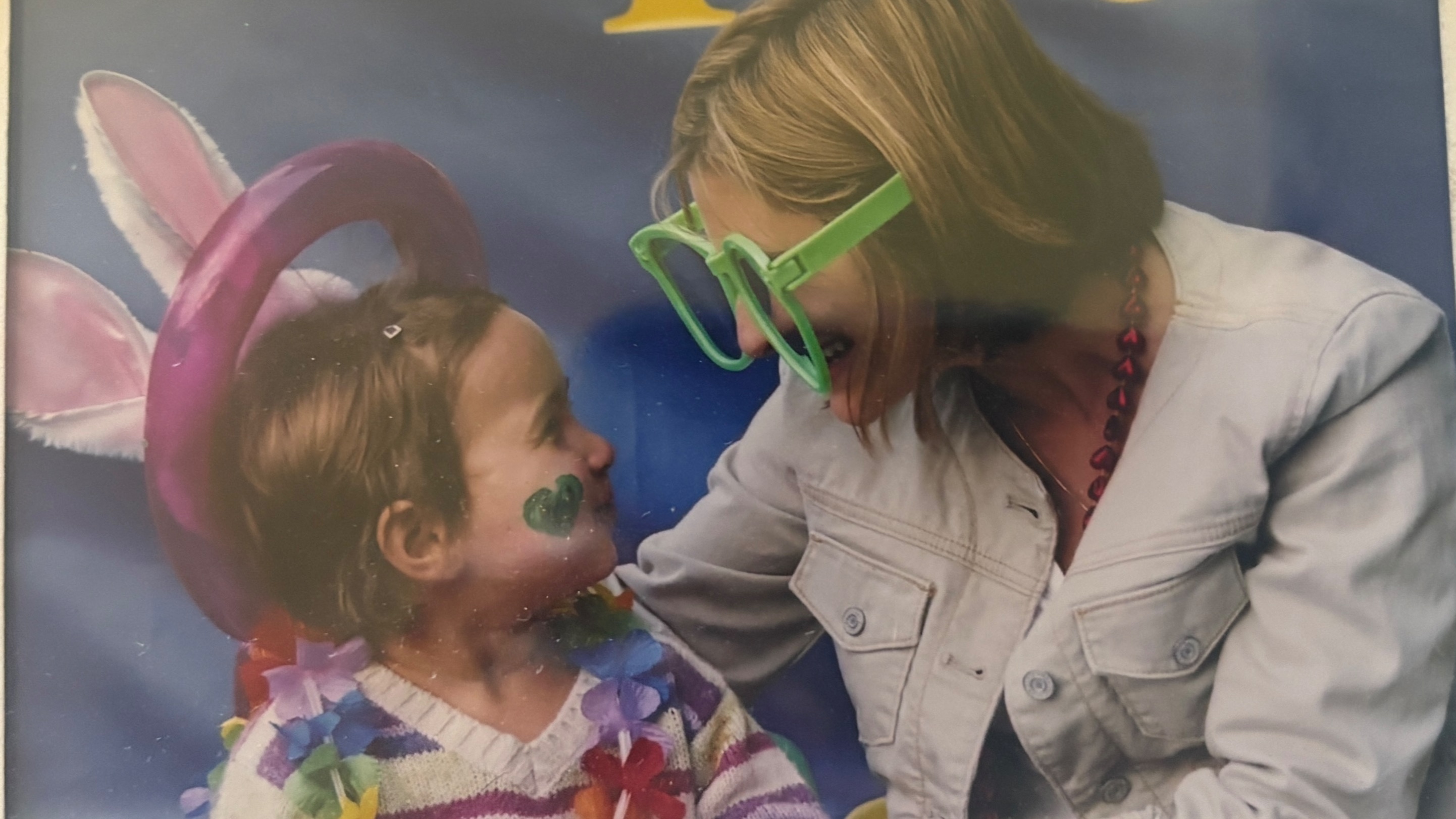 Siah Fried shares a joyful moment with her 3-year-old daughter at a preschool carnival, illustrating the connection, love, and growth that shape the parenting journey