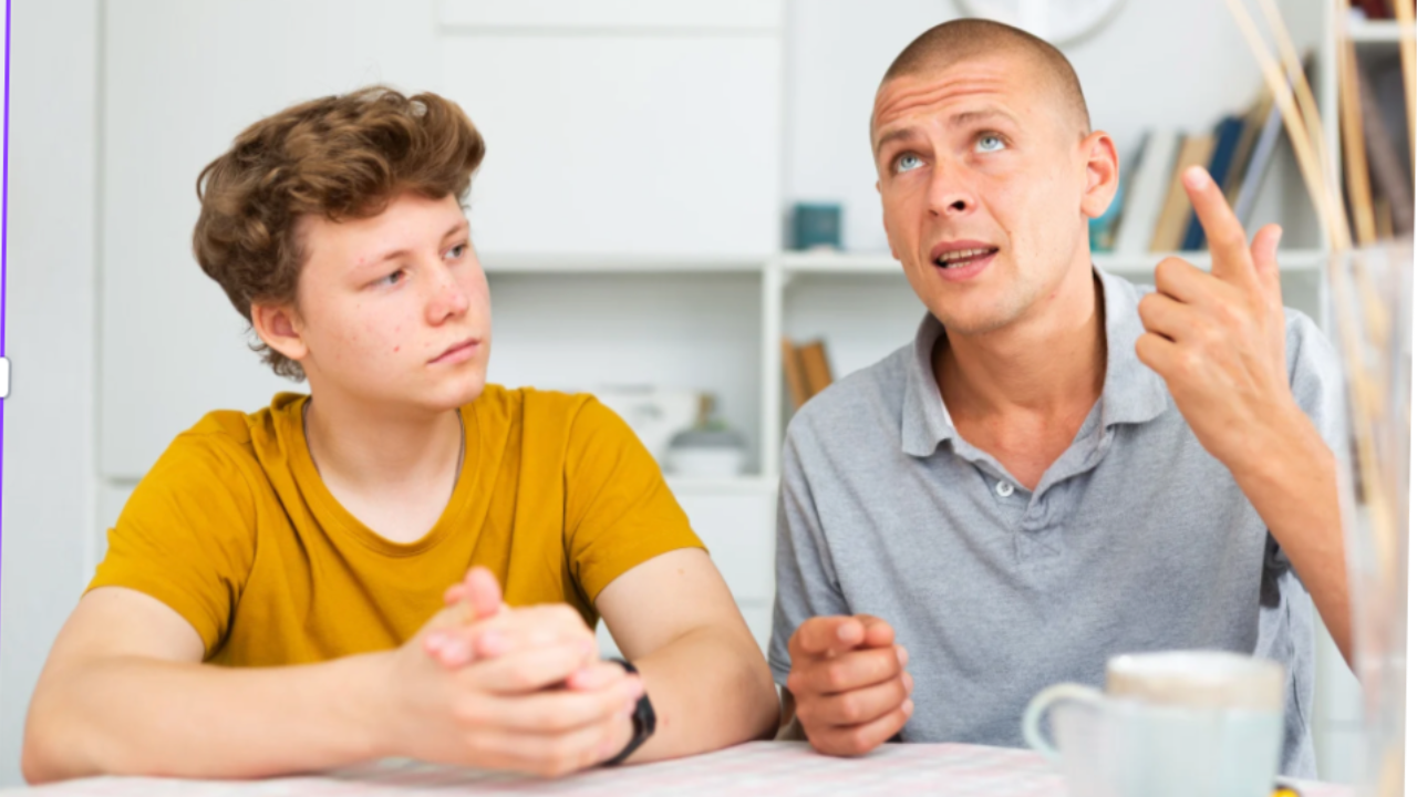 Parent and young adult child sitting together having a heartfelt conversation