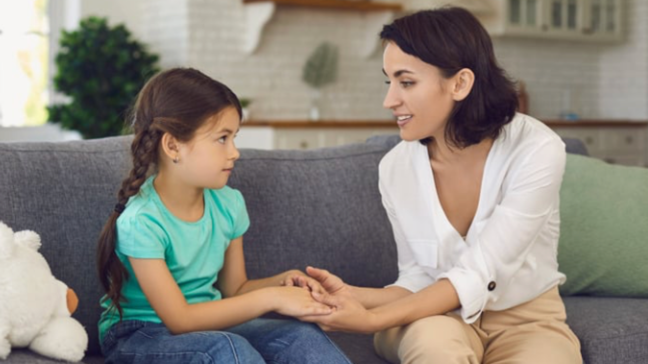  mother and child on couch co-regulating together