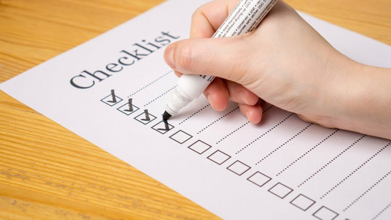 Woman checking off tasks on a checklist while feeling overwhelmed by pressure and achievement expectations.