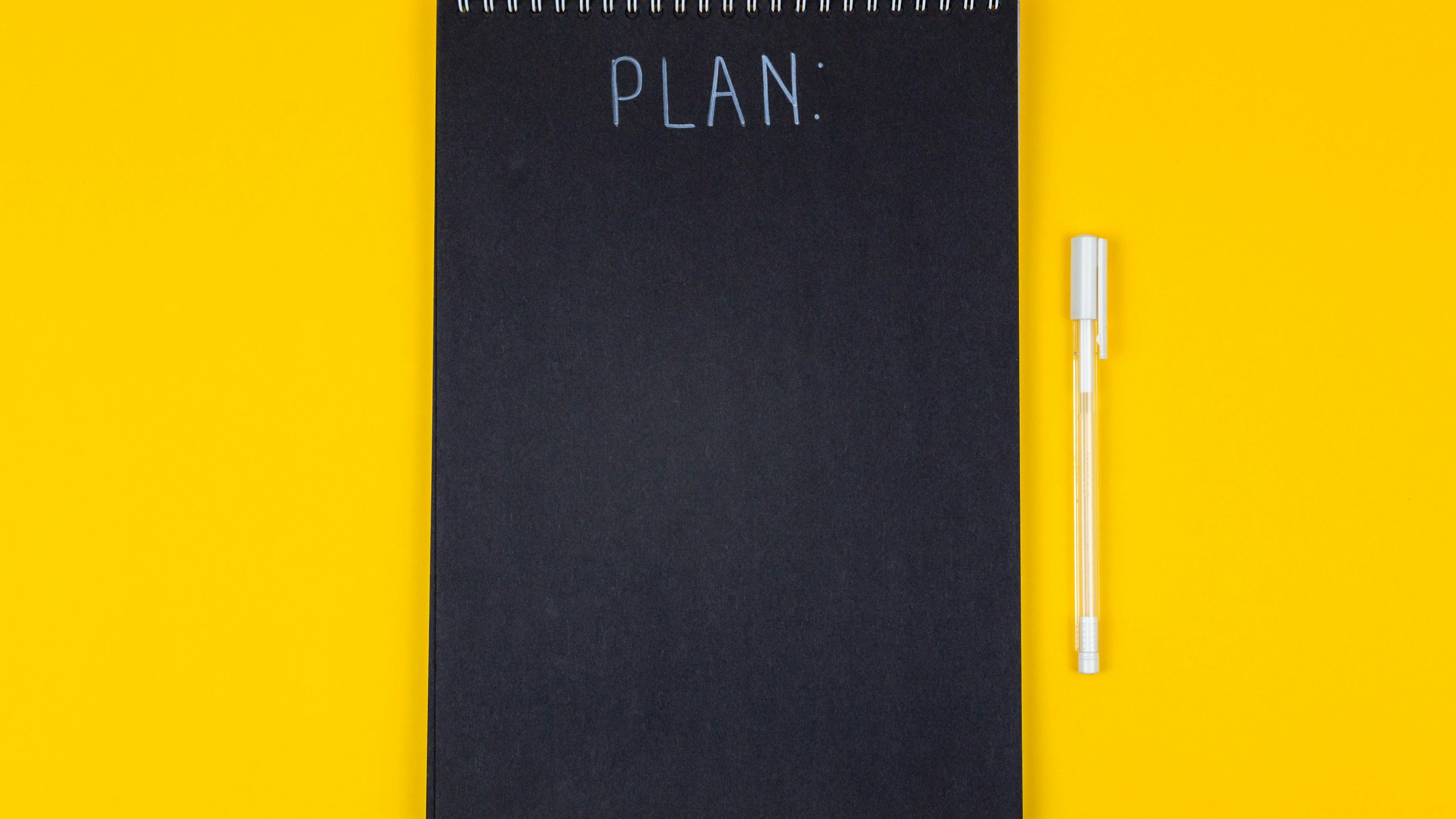 Notebook and planning materials for college visit questions and campus tour preparation