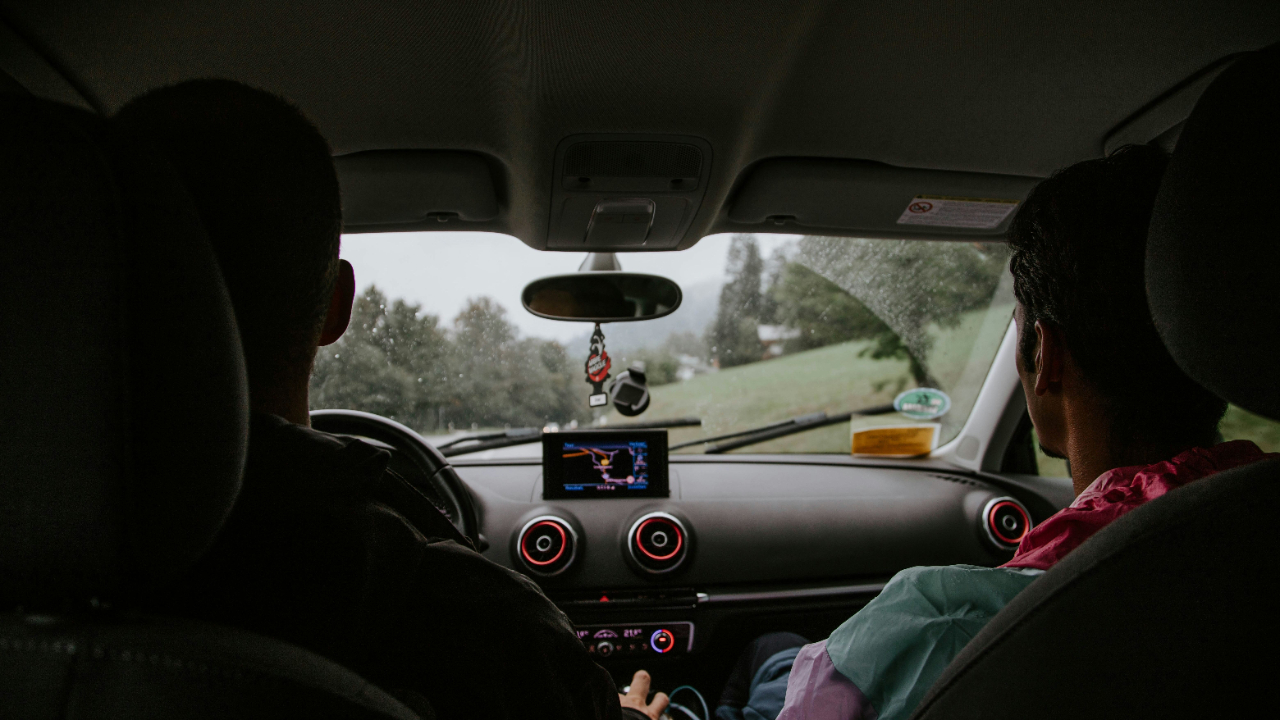 Image of two people in car reflecting on college visit