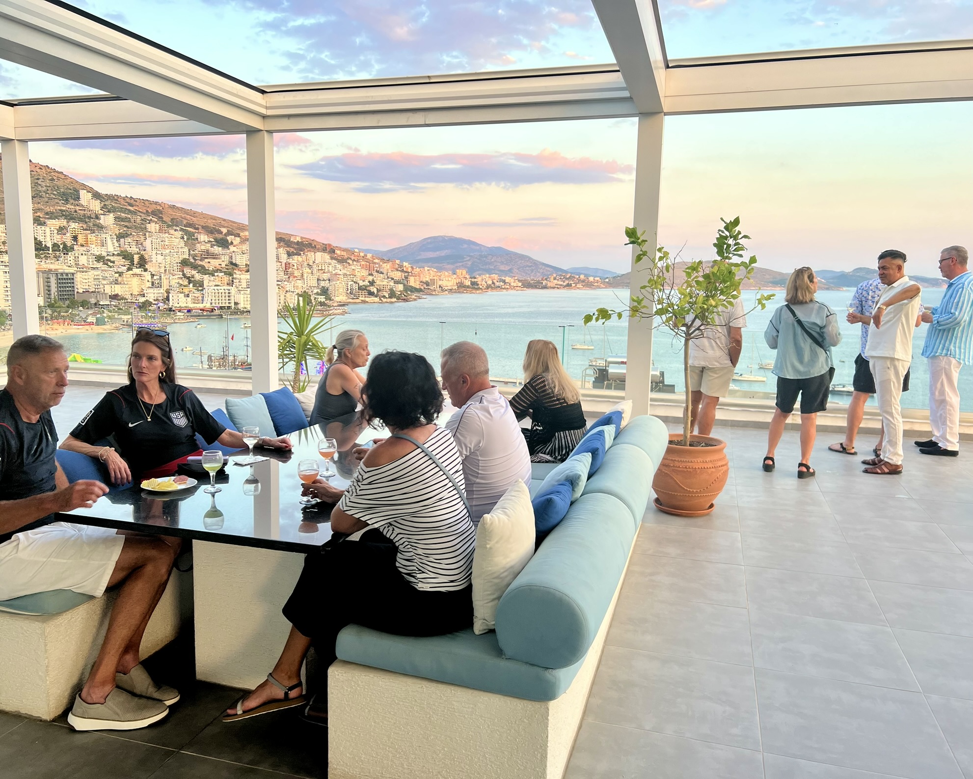 Smile Abroad Club members gathered at a private event on Sam and Spencer’s terrace overlooking Saranda after relocating to Albania