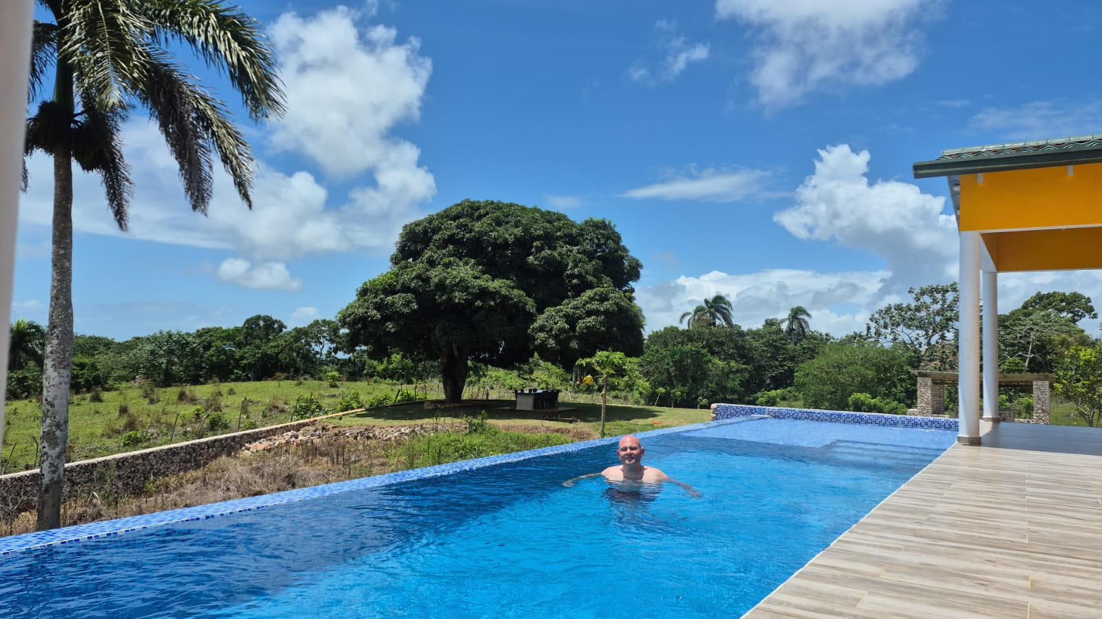 Sam enjoying the Yellow House pool at Finca Jasmat