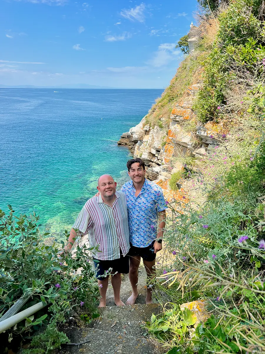 Sam on the left and Spencer on the right, together beside the Mediterranean sea