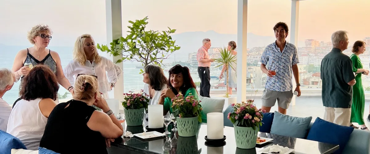 A Smile Abroad community gathering around a table