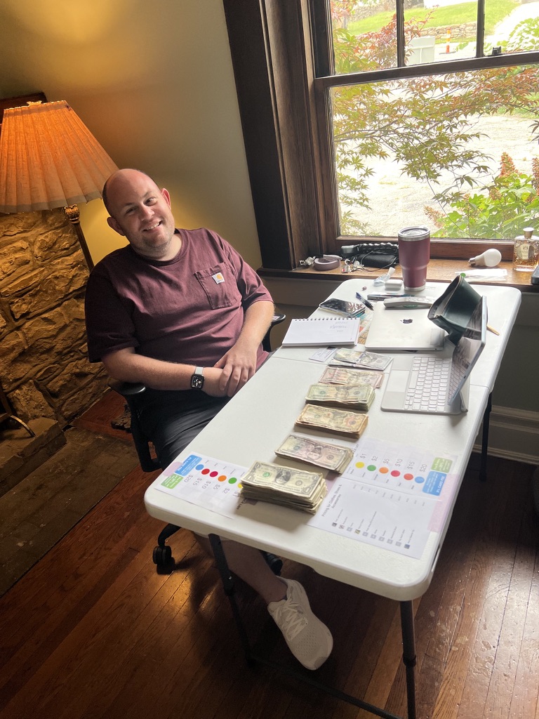 Sam at the checkout desk during our estate sale